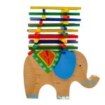 Balancing elephant with wooden pole